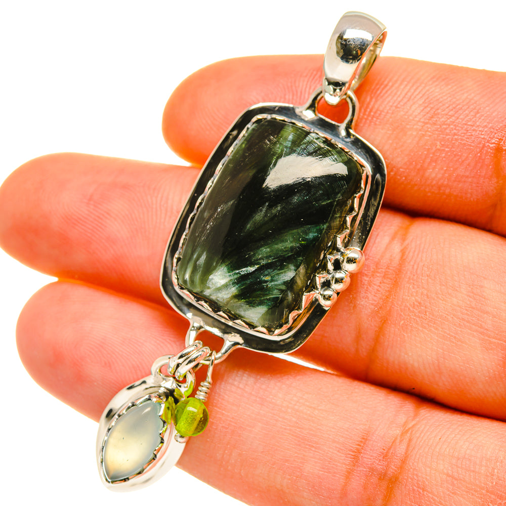 Sterling silver gemstone pendant with large green marbled stone and dangling drop accent