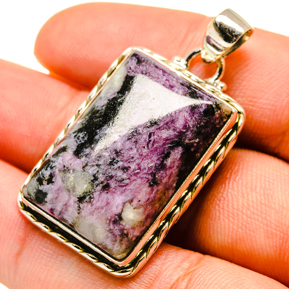 Square sterling silver pendant with purple-pink stone and gold-tone frame, on bail