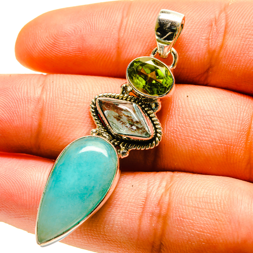 Sterling silver gemstone pendant with blue opal teardrop and green peridot center stone