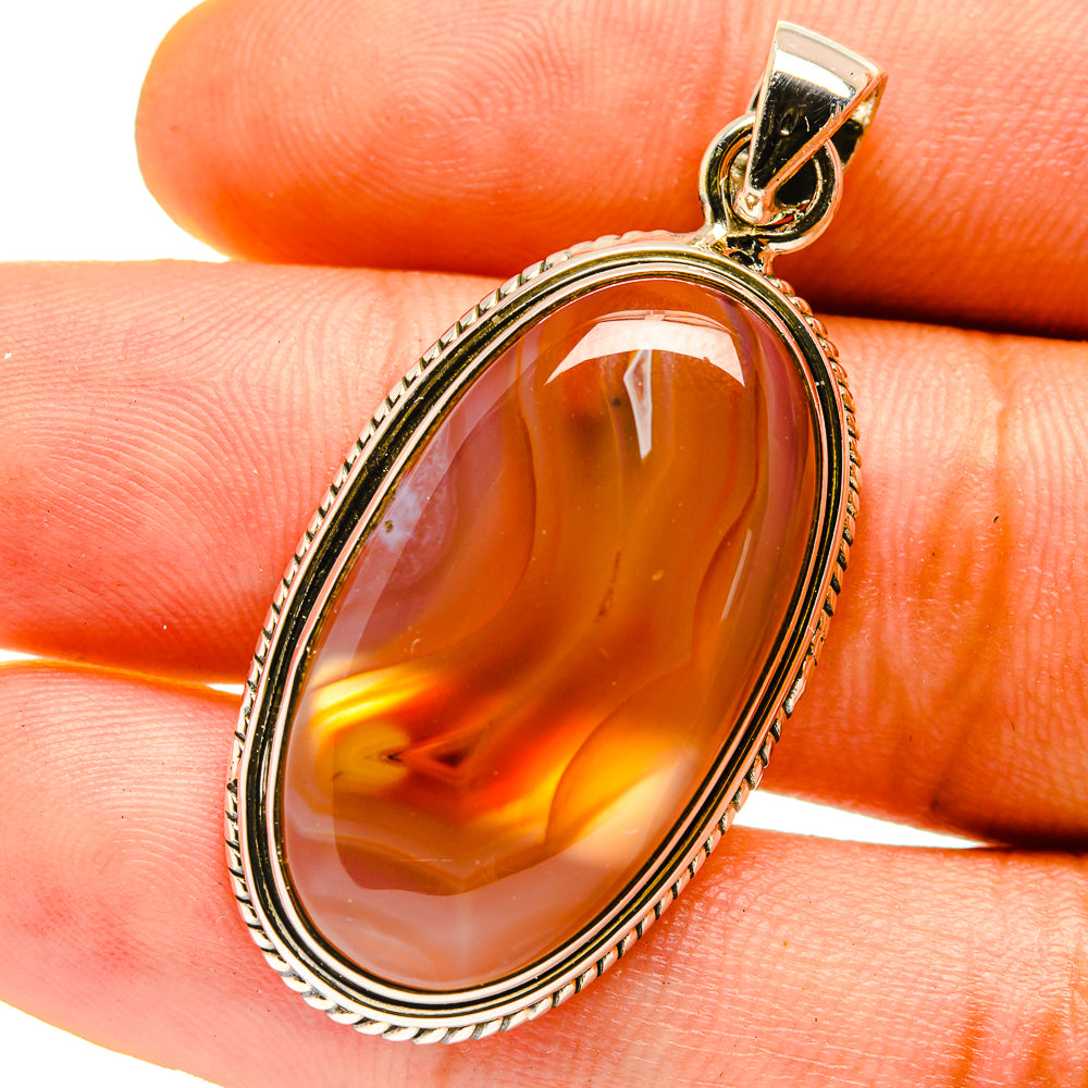 Orange oval agate pendant in 925 sterling silver bezel, with bail loop