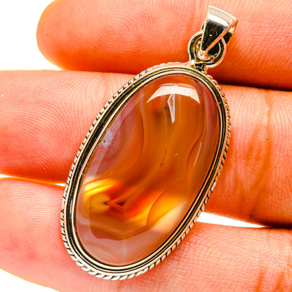 Orange oval agate pendant in 925 sterling silver bezel, with bail loop