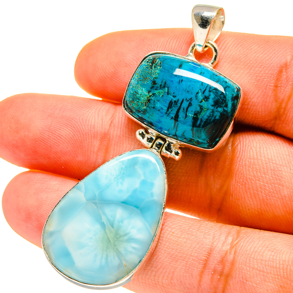 Two-stone sterling silver pendant with teal chrysocolla and light-blue larimar cabochons