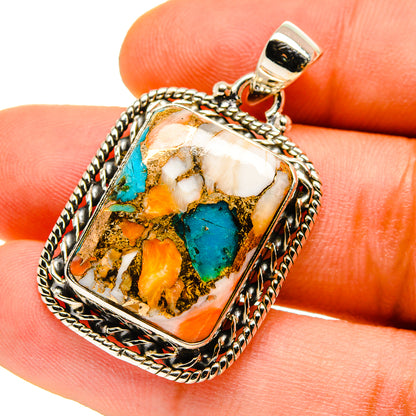 Turquoise and copper composite pendant with square framed cabochon, sterling silver bail.