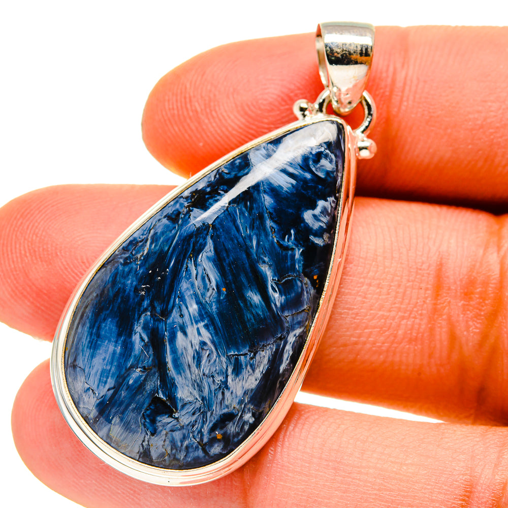 Close-up blue pietersite teardrop pendant with 925 silver bail and frame