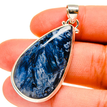 Close-up blue pietersite teardrop pendant with 925 silver bail and frame