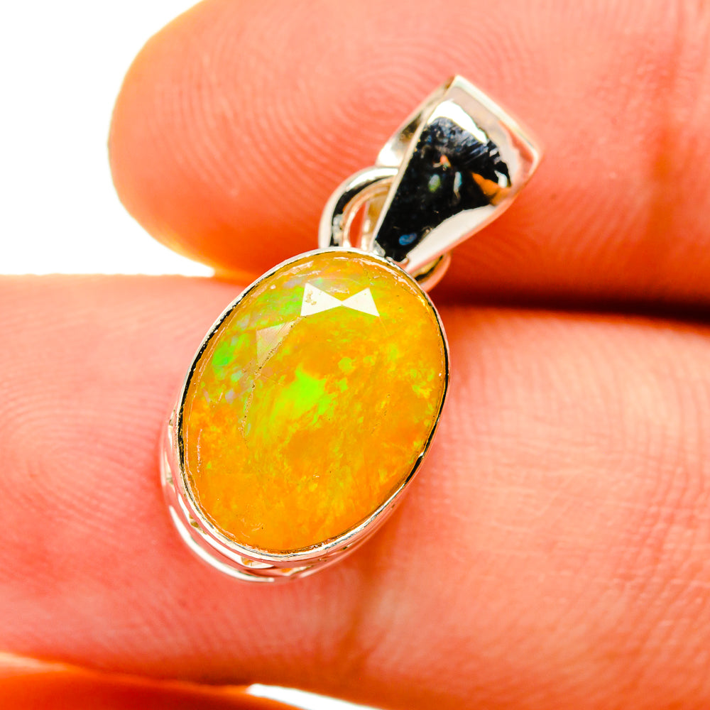 Yellow opal pendant with 925 sterling silver setting and dark top stone