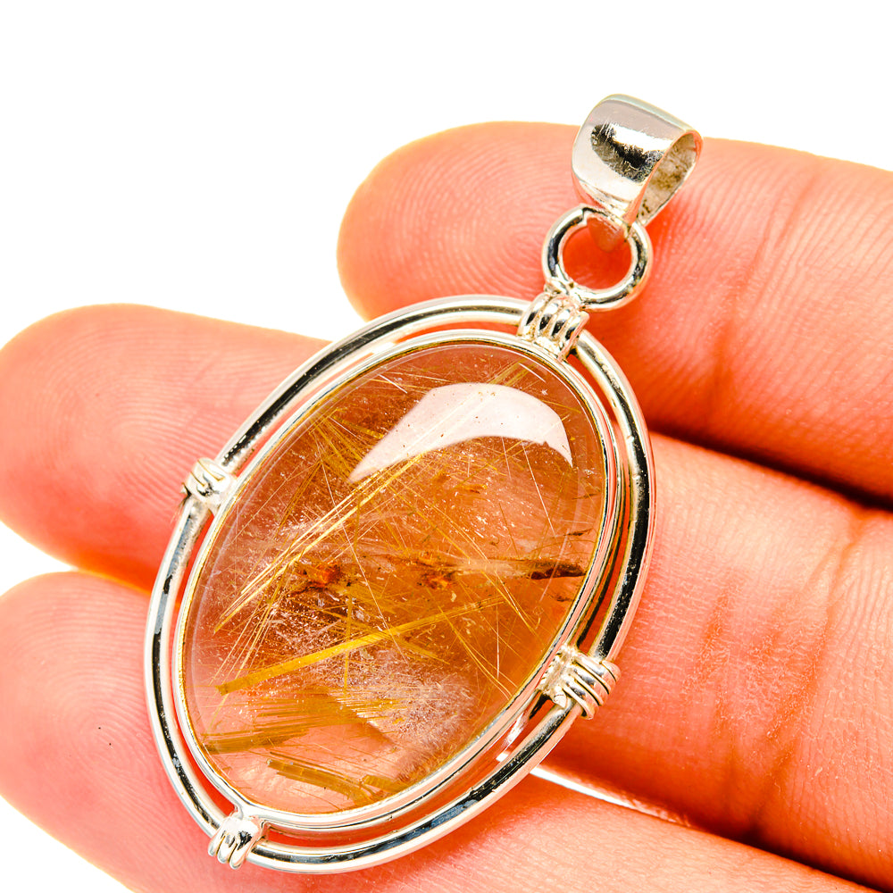Oval sterling silver rutilated quartz pendant with amber stone and golden needle strands