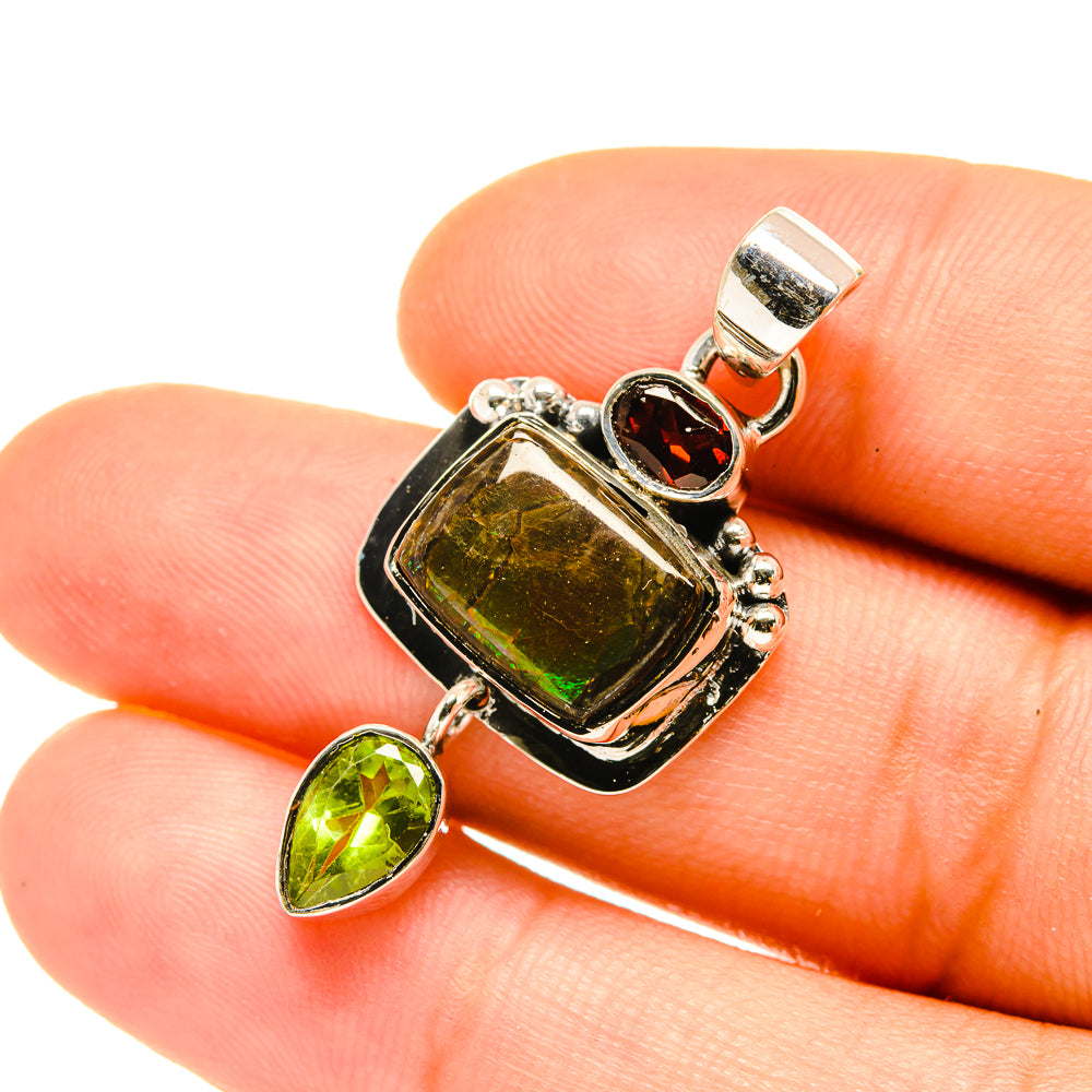 Sterling silver ammolite and peridot pendant with red garnet accent, square frame