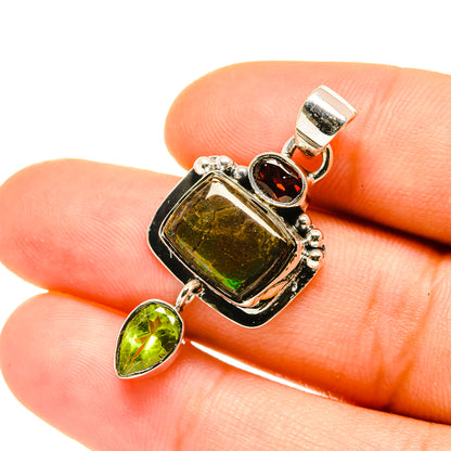 Sterling silver ammolite and peridot pendant with red garnet accent, square frame