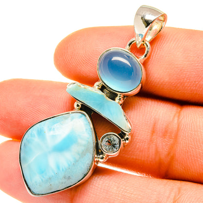 Sterling silver pendant with round and oval blue gemstones and small round accent