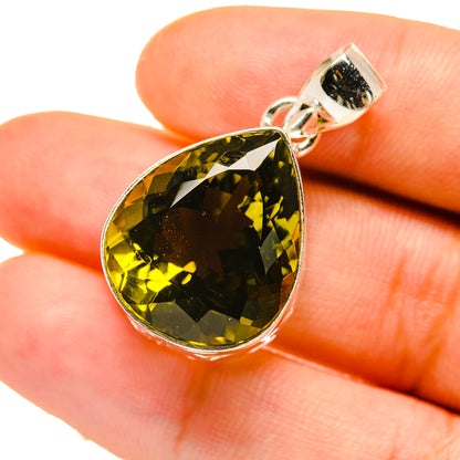 Sterling silver quartz pendant with oval yellow-green gemstone on bail