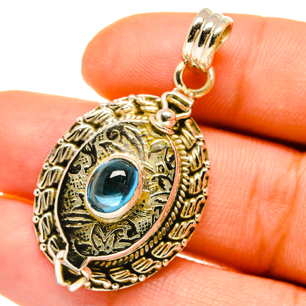 Blue fluorite pendant with ornate 925 sterling silver frame and blue oval stone
