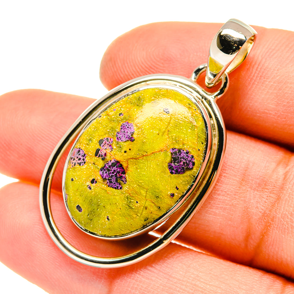 Oval sterling silver pendant with yellow cabochon and purple speckled pattern, bail loop