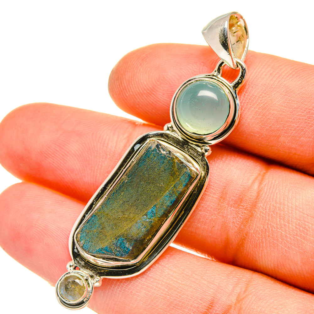 Sterling silver pendant with round teal chalcedony and rough rectangular labradorite