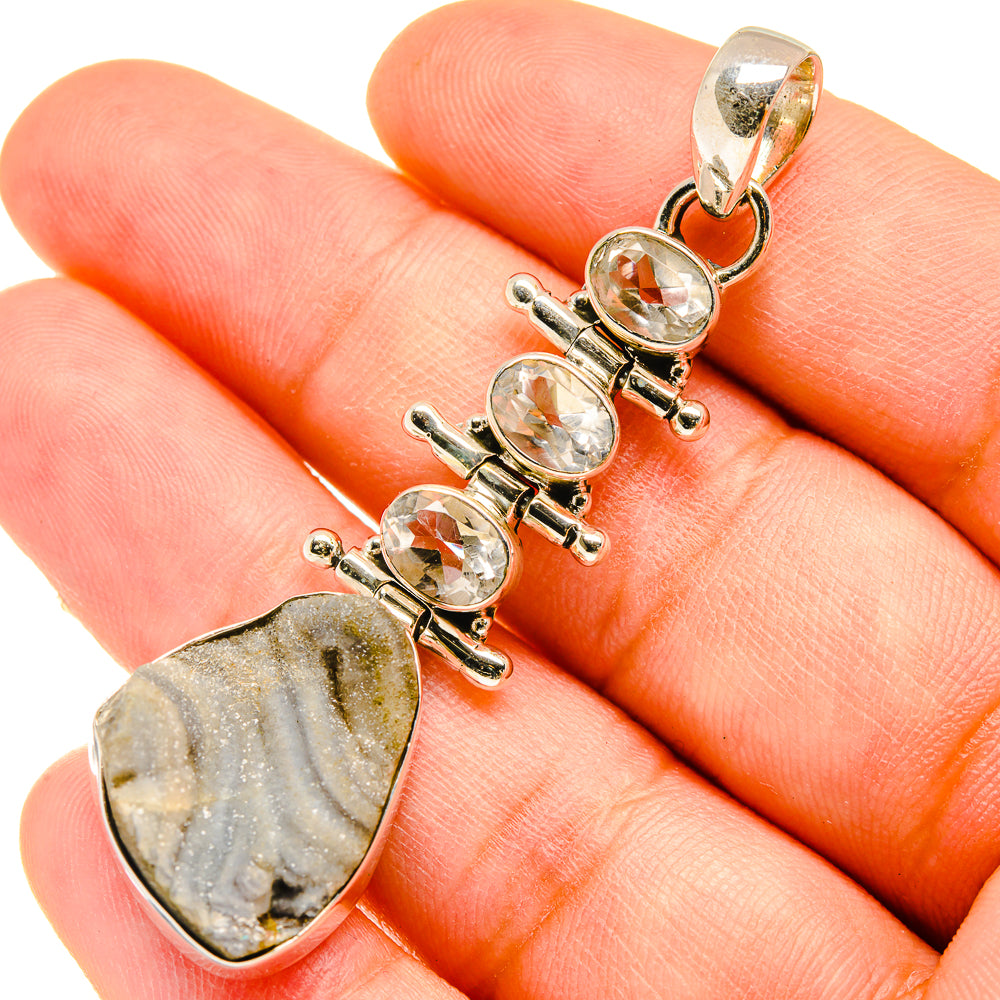 Quartz pendant with clear round stones and gray striped teardrop druzy gemstone, gold-tone