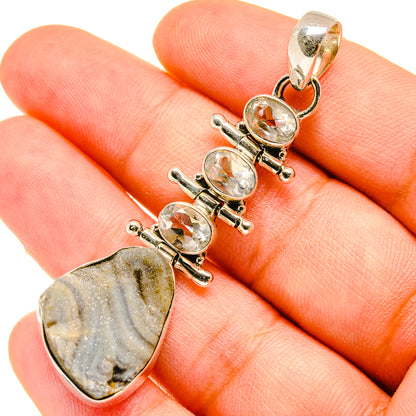 Quartz pendant with clear round stones and gray striped teardrop druzy gemstone, gold-tone