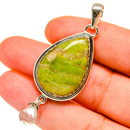Sterling silver pendant with pear-shaped green opal and white quartz dangle, close-up