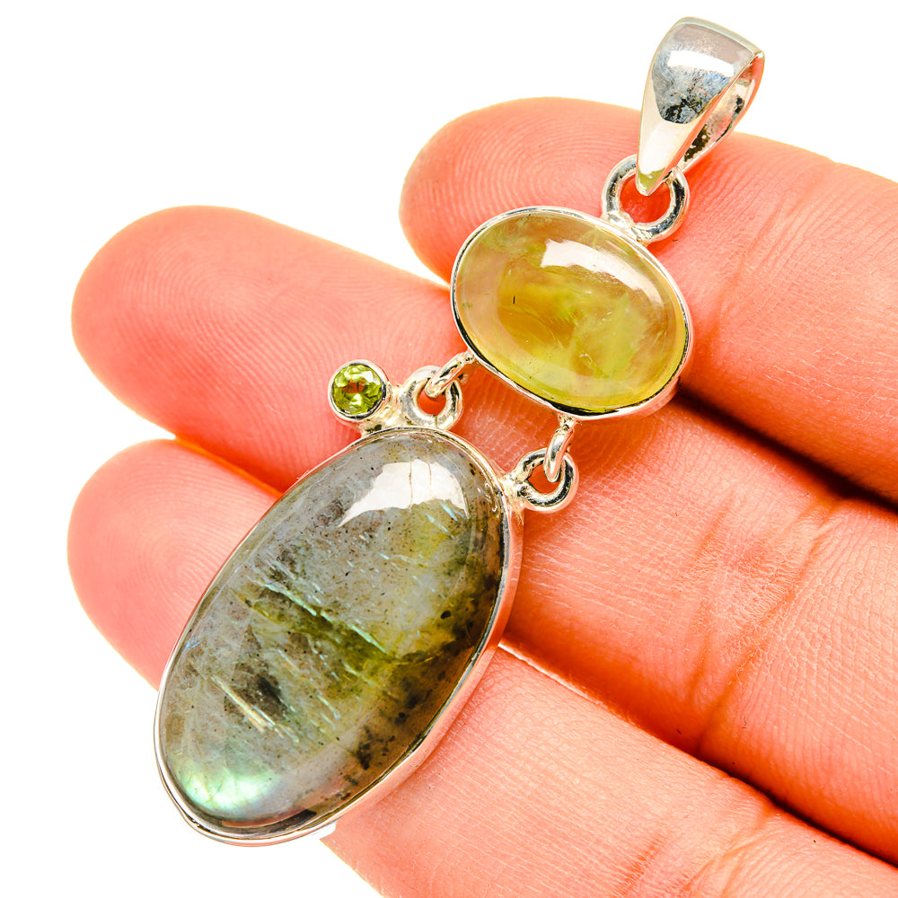 Sterling silver pendant with oval green stones and small peridot accents on bail