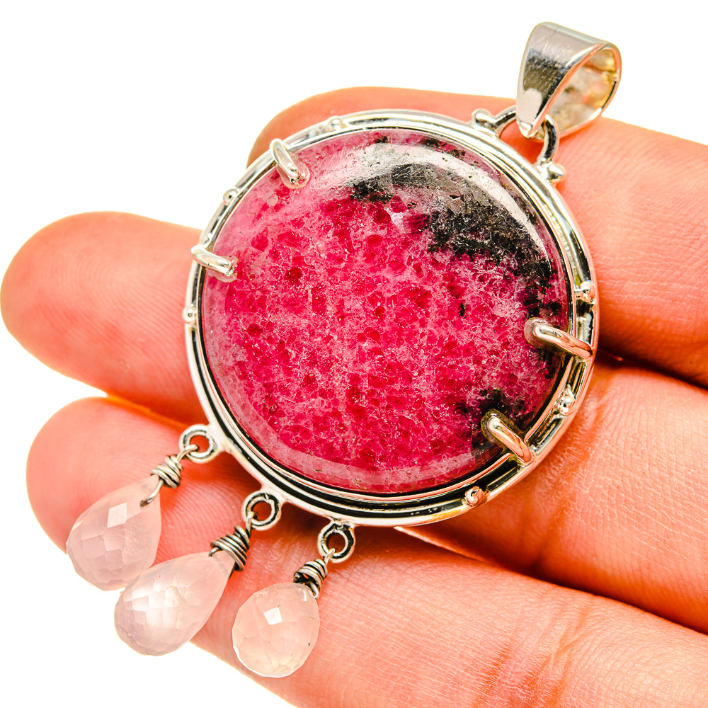 Rhodonite rose quartz pendant: round pink stone in silver bezel with dangling quartz drops
