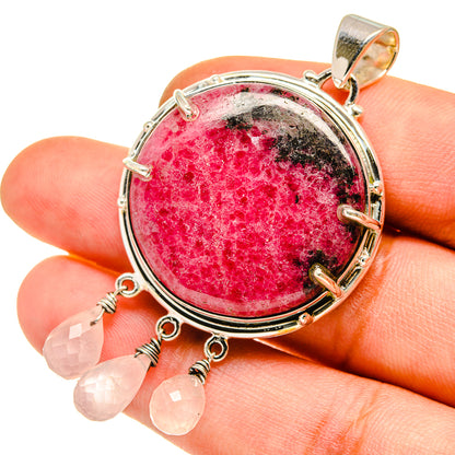 Rhodonite rose quartz pendant: round pink stone in silver bezel with dangling quartz drops