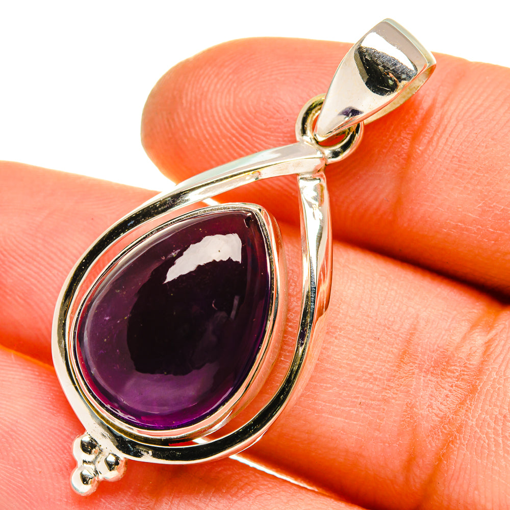 Amethyst teardrop pendant in sterling silver with purple stone and loop bail