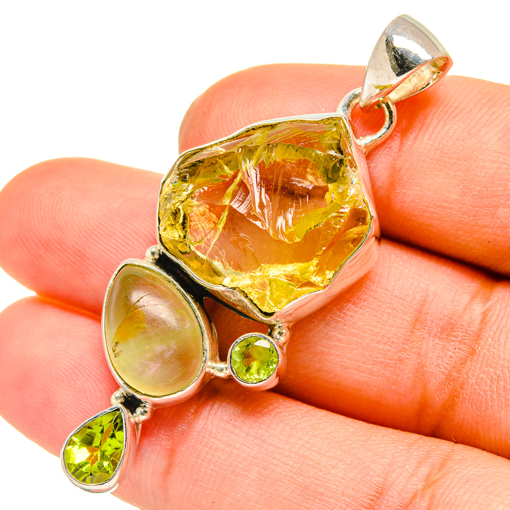 Sterling silver pendant with rough yellow citrine, prehnite discs, and green peridot teardrops