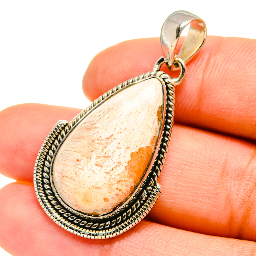 Scolecite teardrop pendant with peach-beige stone in ornate 925 silver frame