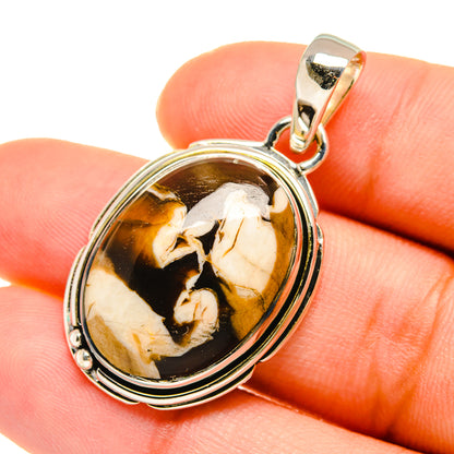 Oval 925 sterling silver pendant with peanut wood jasper center and polished bail