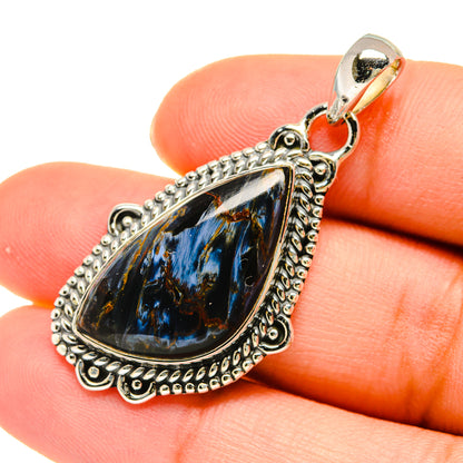 Pietersite sterling silver teardrop pendant with ornate bezel and blue black stone
