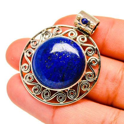 Lapis lazuli pendant in ornate 925 sterling silver with round blue stone and gold bail