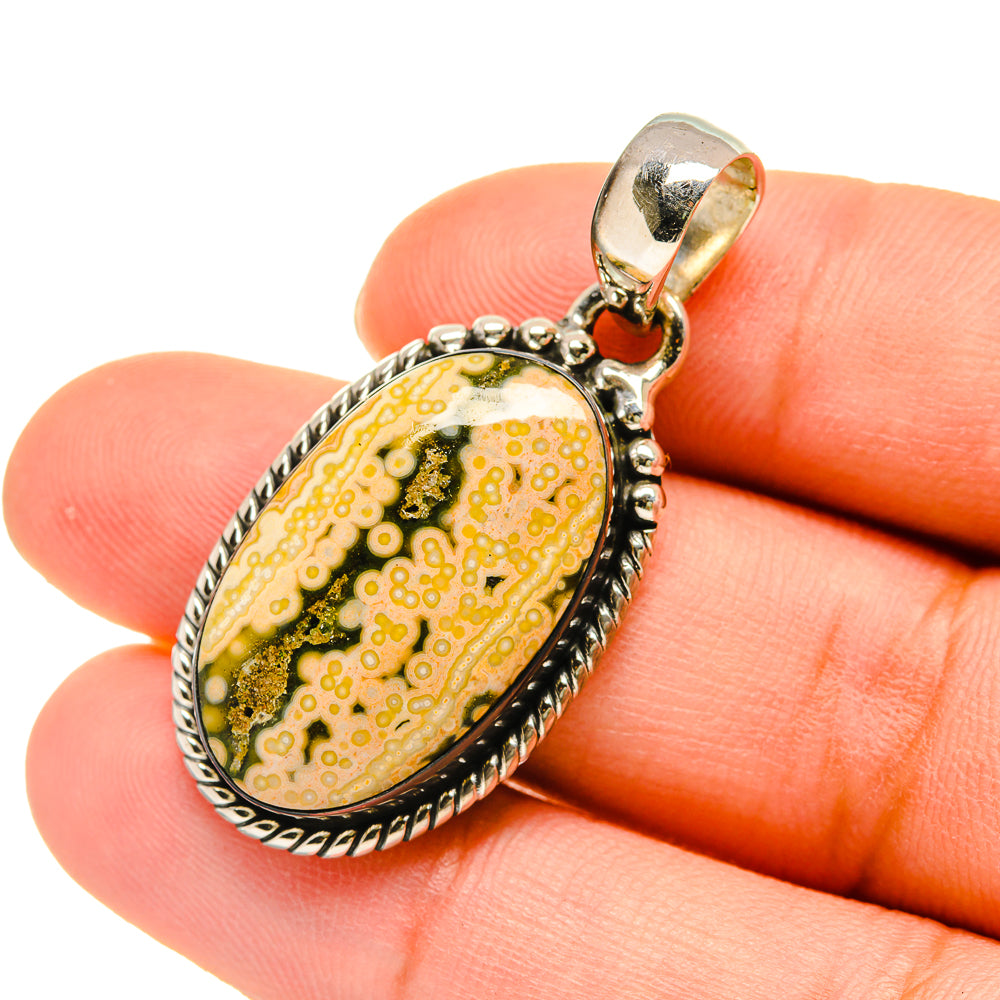 Ocean jasper pendant in oval sterling silver bezel, yellow green with dark speckles