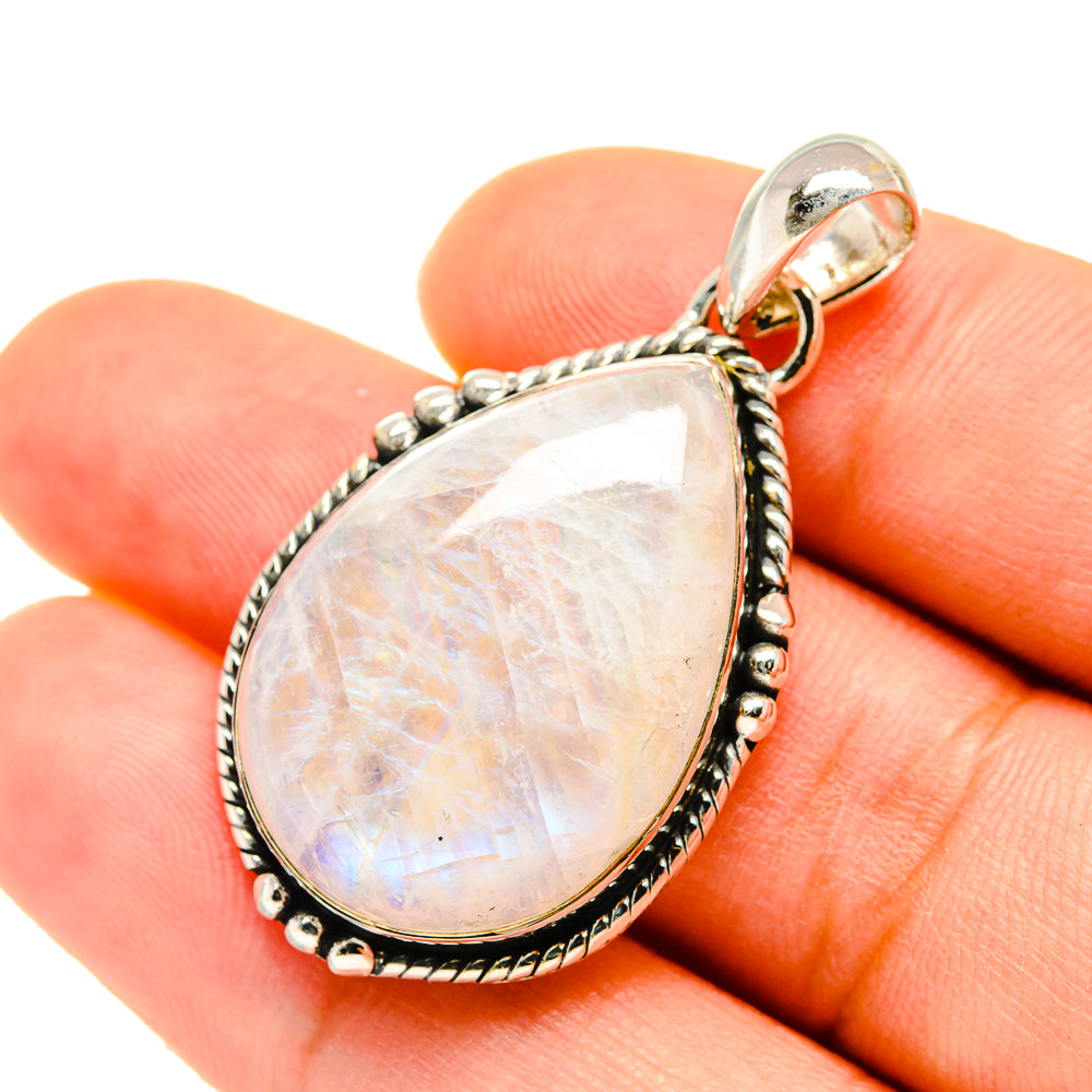 Teardrop rainbow moonstone pendant, pearly iridescent stone in silver bezel and bail