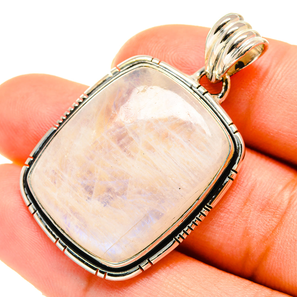 Rainbow moonstone pendant in sterling silver bezel with ridged edge and bail