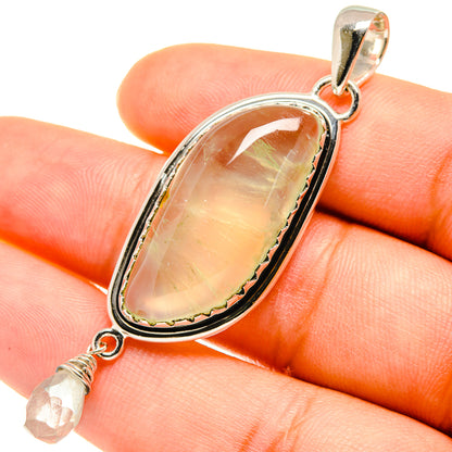 Oval prehnite-like pendant with white quartz drop, 925 sterling silver bezel setting.