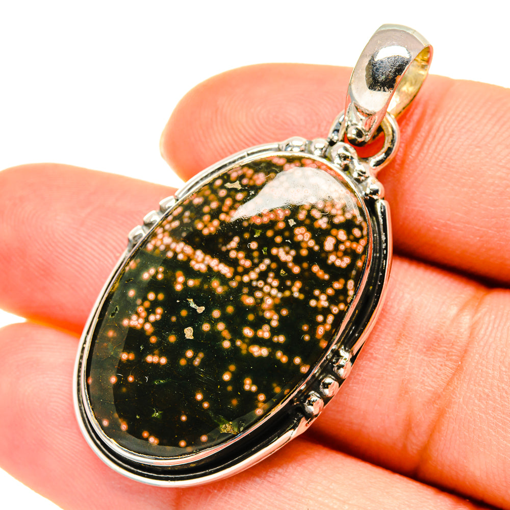 Oval ocean jasper pendant with speckled green-brown gemstone and 925 sterling silver setting