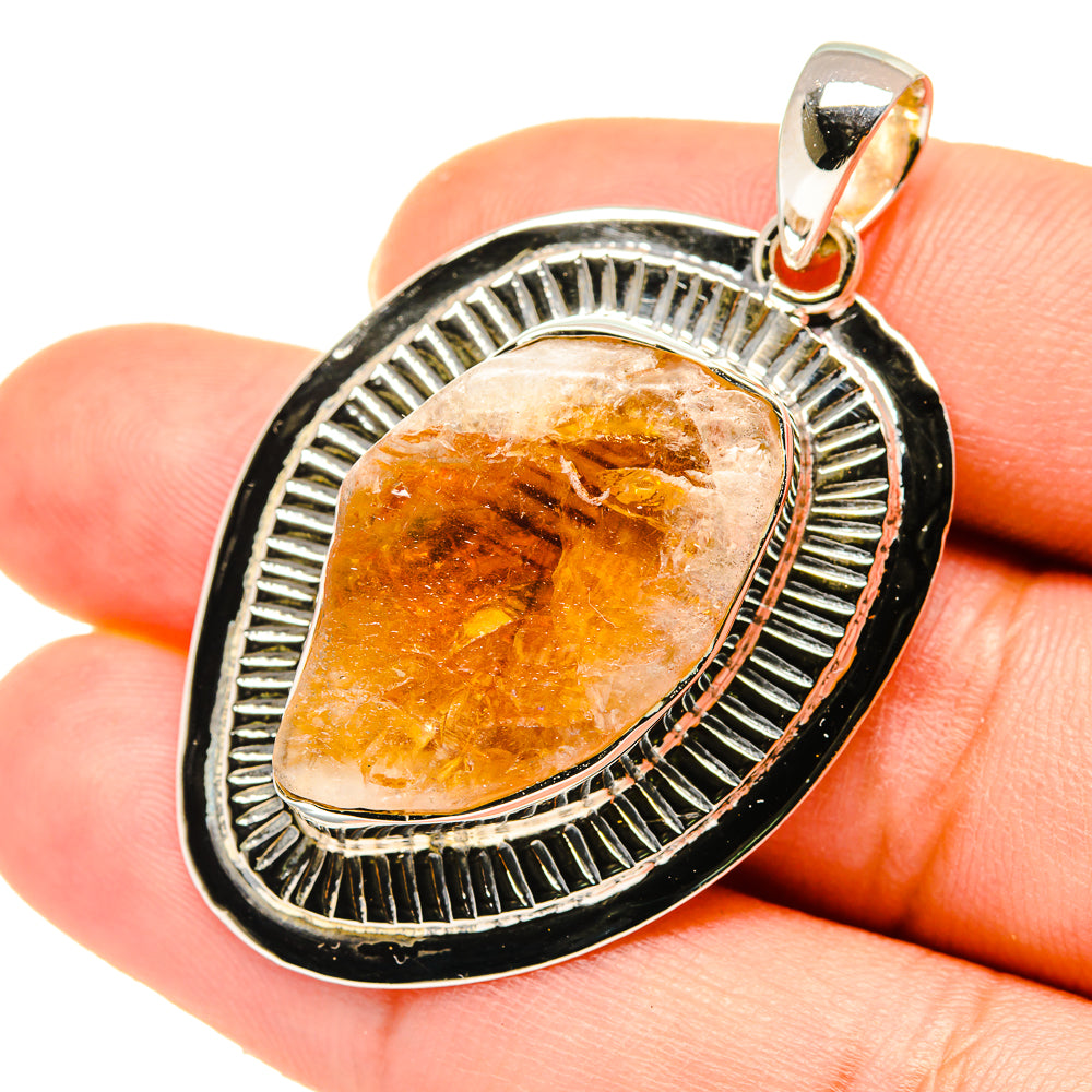 Rough citrine pendant with blackened silver bezel and textured halo border