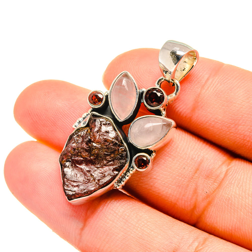Rough garnet and rose quartz pendant with marbled teardrops, round dark red accents, silver bail