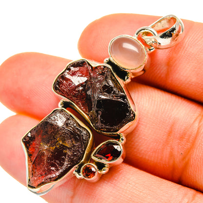 Rough red garnet pendant with small round accents and pale pink rose quartz stone