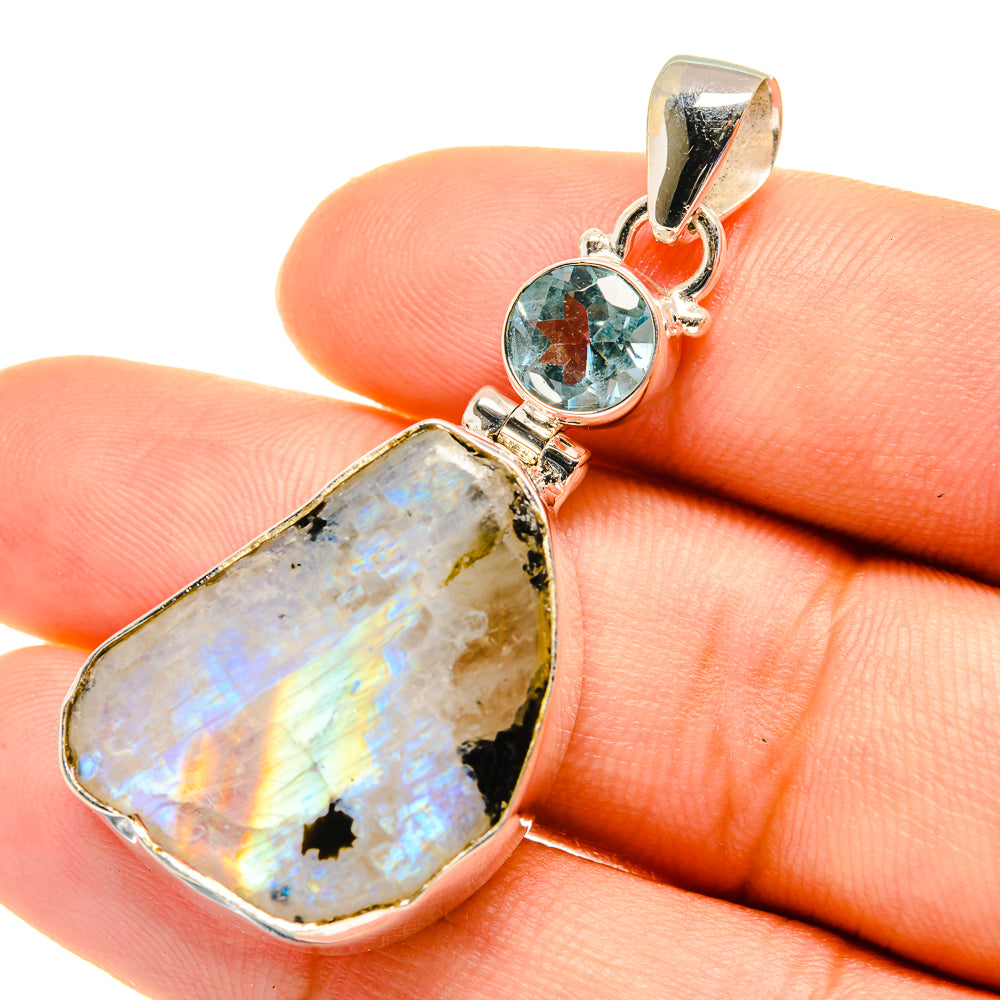 925 sterling silver pendant with rough rainbow moonstone and round blue topaz accent
