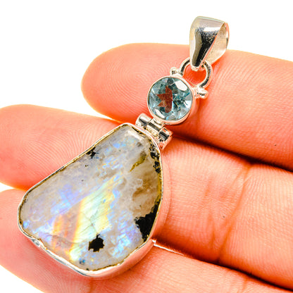 925 sterling silver pendant with rough rainbow moonstone and round blue topaz accent
