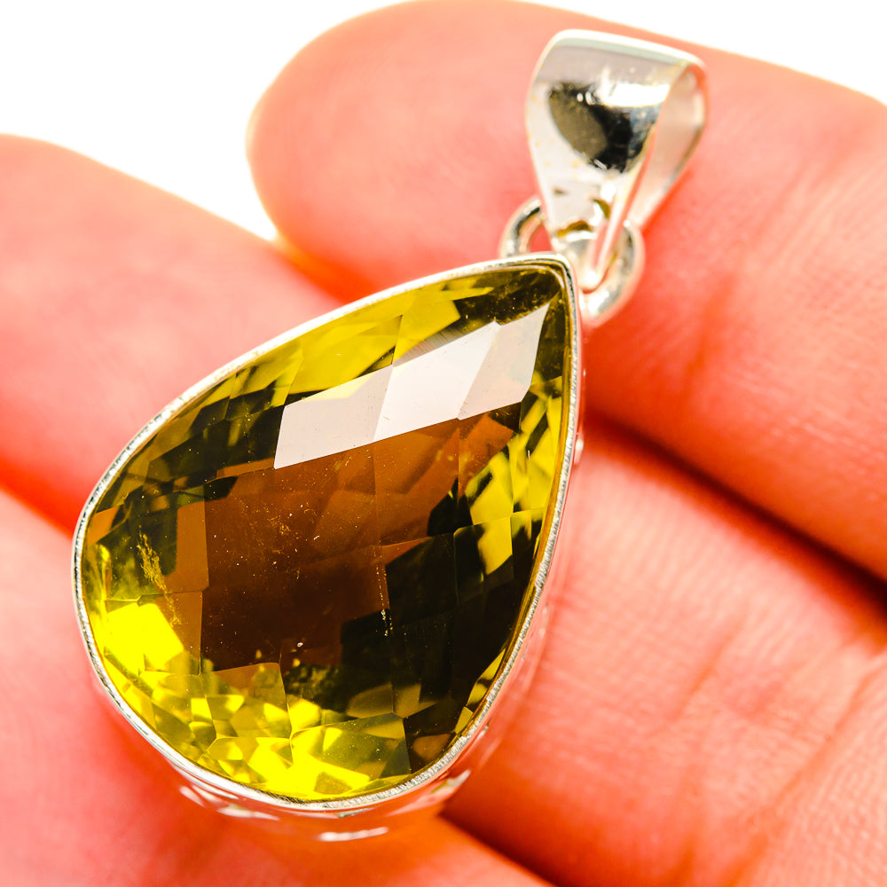 Olive quartz teardrop pendant in sterling silver, close-up on gemstone