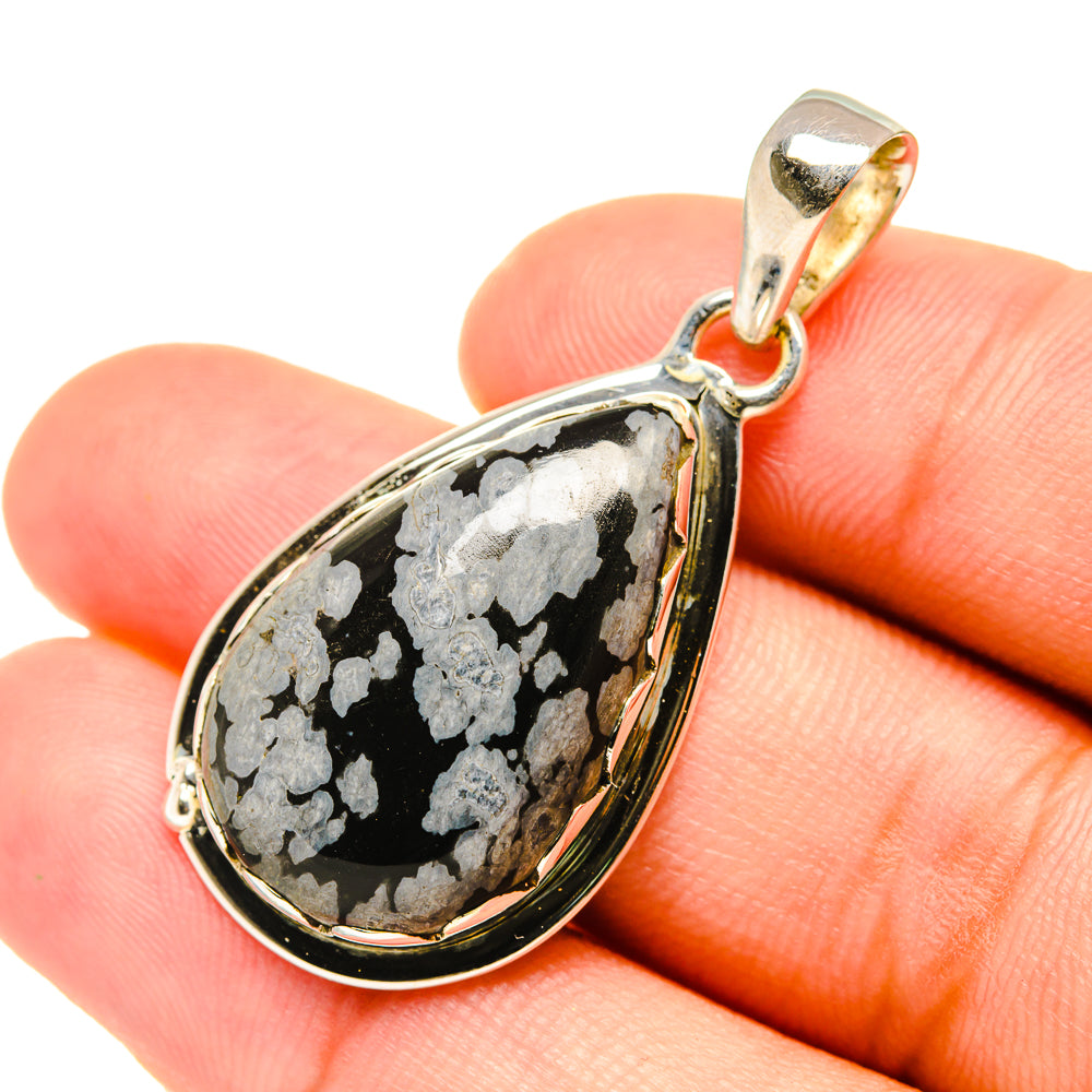 Obsidian teardrop pendant with snowflake pattern and silver bail