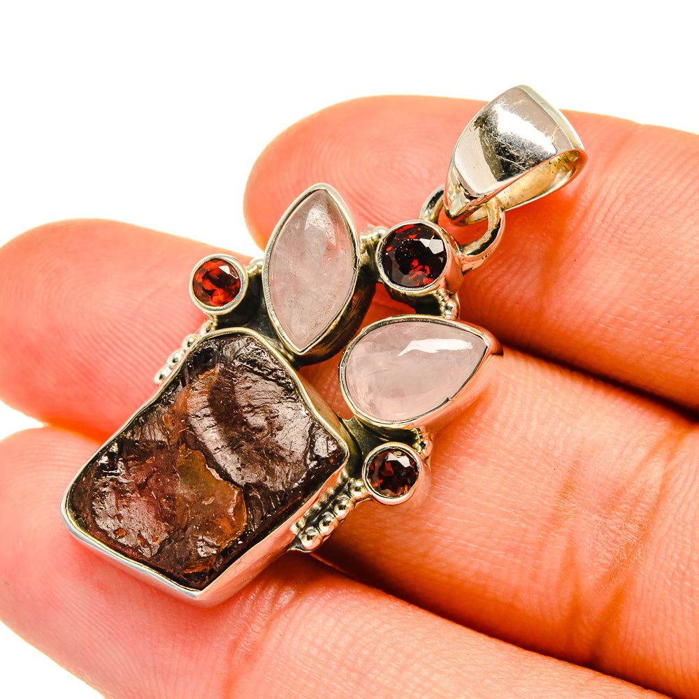 Sterling silver pendant with rough garnet, pink moonstone, and red accent stones