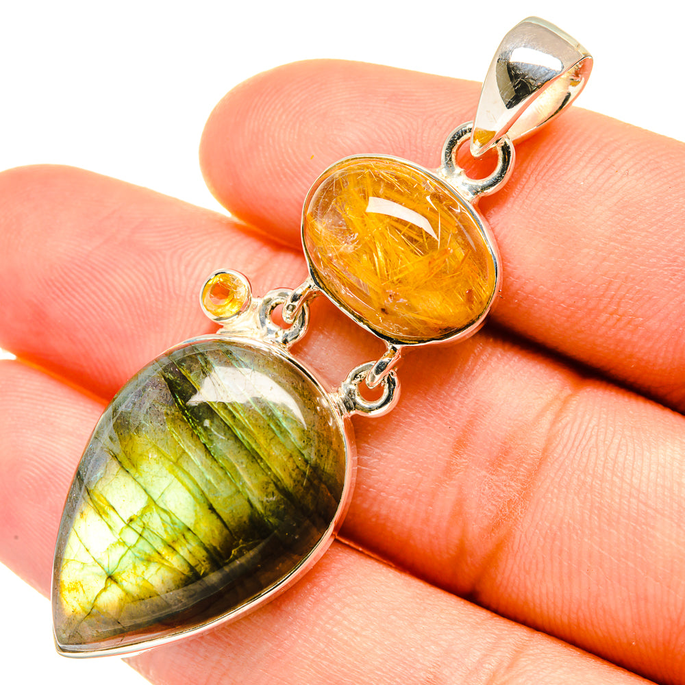 Sterling silver double teardrop pendant with orange rutilated and green-striped stone