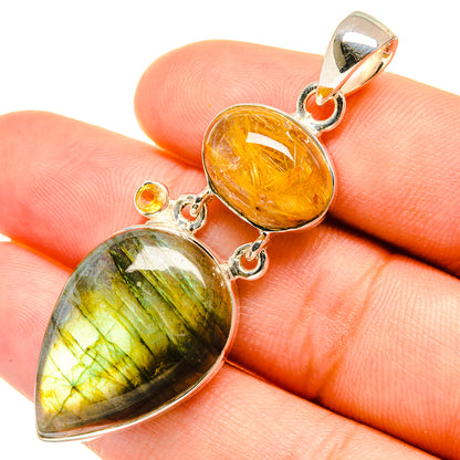 Sterling silver double teardrop pendant with orange rutilated and green-striped stone