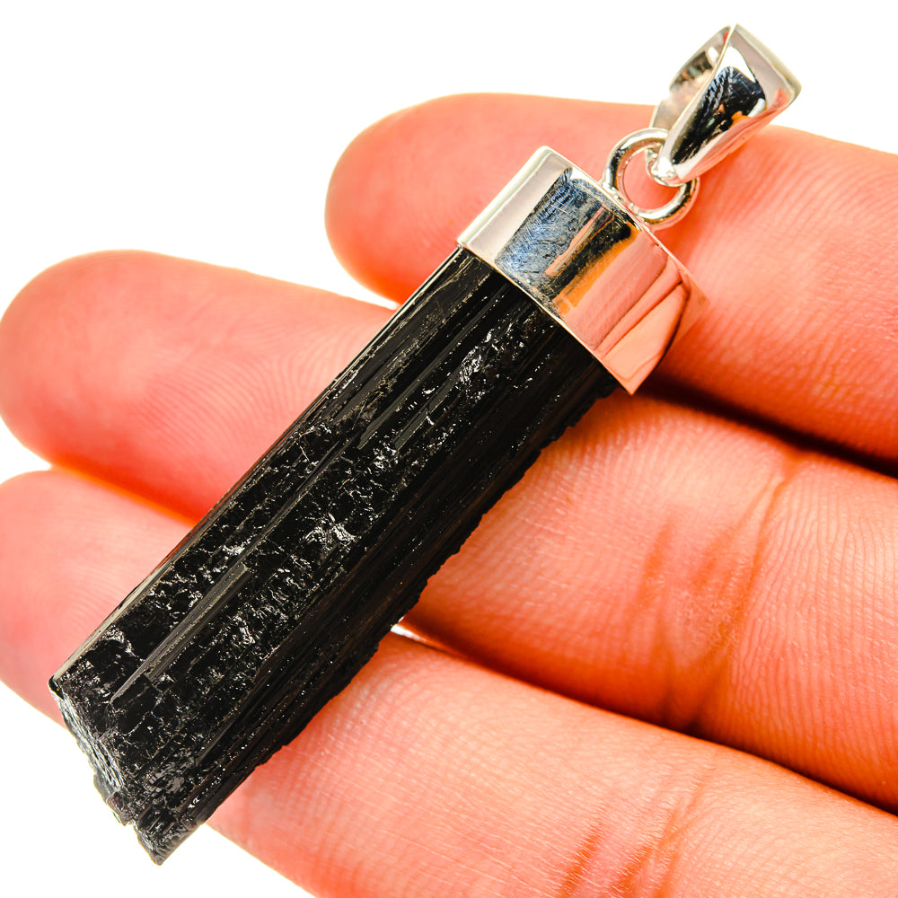 Tektite pendant with black tektite stone and 925 silver bail, close-up.