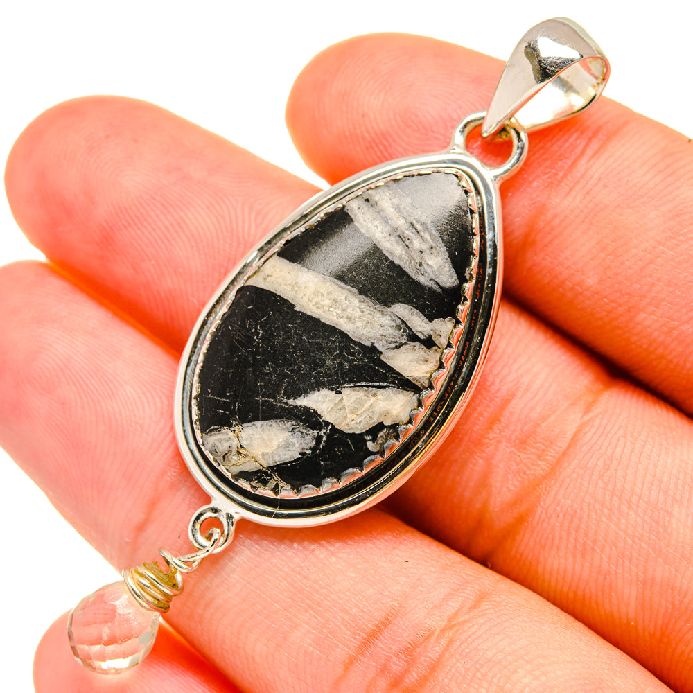 Sterling silver quartz pendant close-up with teardrop setting and black-and-white stone detail