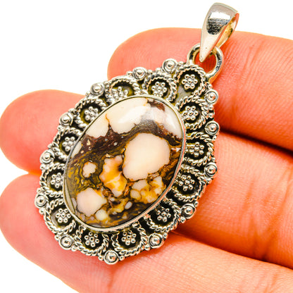 Jasper pendant with oval peanut-wood jasper cabochon in ornate silver frame, bail