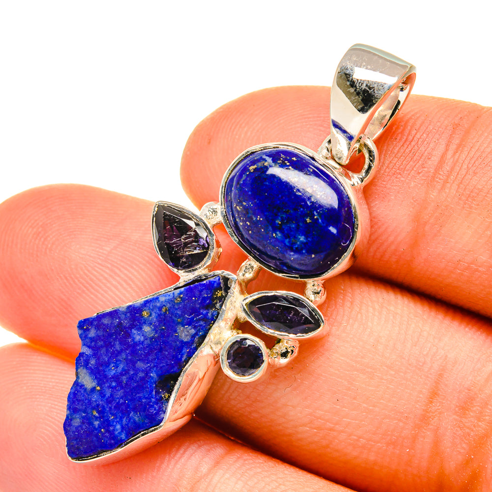 Sterling silver lapis lazuli pendant with round blue cabochon and rough stone tips