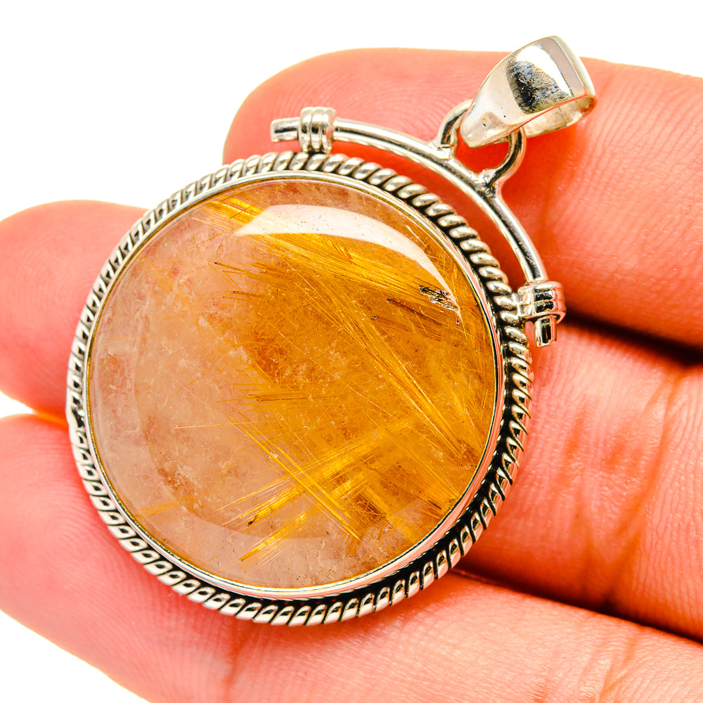 Rutilated quartz pendant with orange-gold cabochon and 925 sterling silver bezel